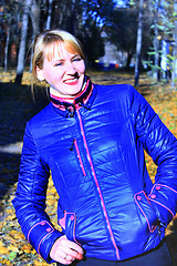 Image showing modern fashionable smiling woman in blue jacket