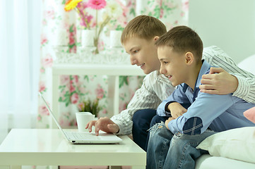 Image showing Young boys and  laptop computer
