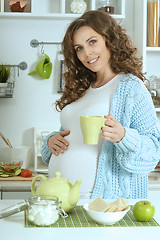 Image showing beautiful pregnant woman with   tea