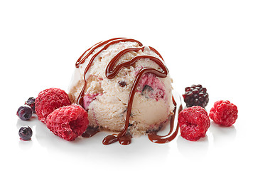 Image showing Ice cream ball with chocolate sauce and frozen berries