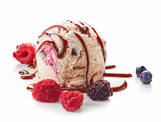 Image showing Ice cream ball with chocolate sauce and frozen berries