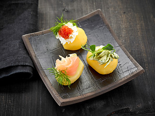 Image showing decorated boiled potatoes on plate