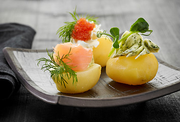 Image showing decorated boiled potatoes on plate