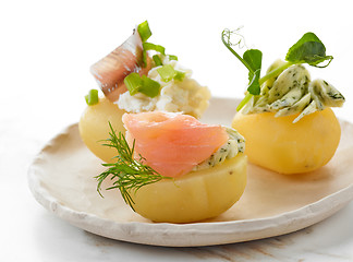 Image showing decorated boiled potatoes on plate