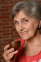 Image showing  aged woman drinking 