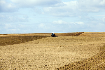 Image showing tractor plowing field  