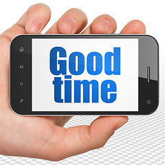 Image showing Time concept: Hand Holding Smartphone with Good Time on display