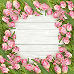 Image showing Pink tulips on wooden background. EPS 10