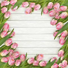 Image showing Pink tulips on wooden background. EPS 10