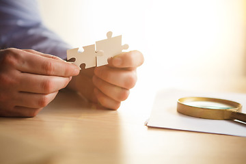 Image showing Building a business success. The hands with puzzles