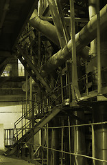Image showing assortment of different size and shaped pipes at a power plant