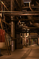 Image showing assortment of different size and shaped pipes at a power plant