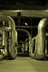 Image showing An assortment of different size and shaped pipes at a power plan