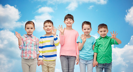 Image showing happy smiling little children holding hands