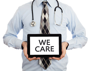 Image showing Doctor holding tablet - We care