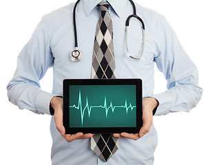 Image showing Doctor holding tablet - Heartbeat graph