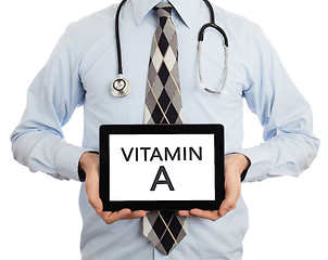 Image showing Doctor holding tablet - Vitamin A