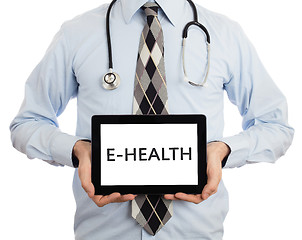 Image showing Doctor holding tablet - E-Health