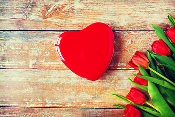 Image showing close up of red tulips and chocolate box