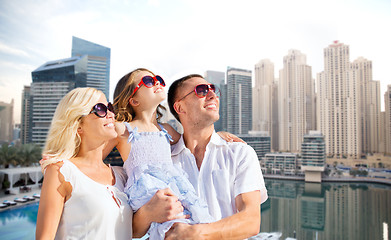 Image showing happy family over dubai city background