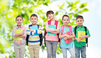 Image showing happy children with school bags and notebooks