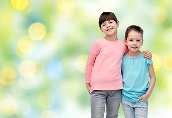 Image showing happy smiling little girls hugging