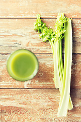 Image showing close up of fresh green juice glass and celery