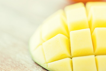 Image showing close up of ripe mango slice on table