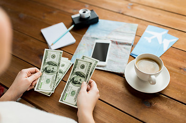 Image showing close up of traveler hands counting dollar money