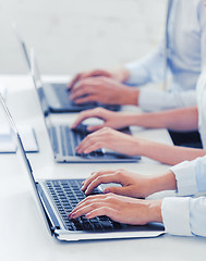 Image showing group of people working with laptops in office