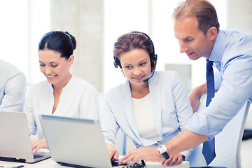 Image showing group of people working in call center