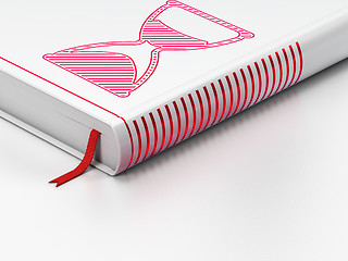 Image showing Timeline concept: closed book, Hourglass on white background