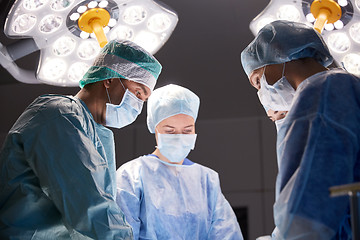 Image showing group of surgeons in operating room at hospital