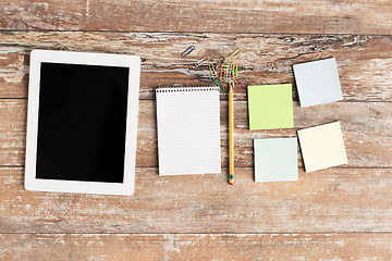 Image showing close up of notebook, stickers and tablet pc