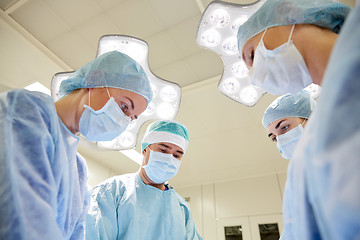 Image showing group of surgeons in operating room at hospital