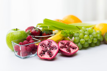 Image showing close up of fresh fruits and berries on table