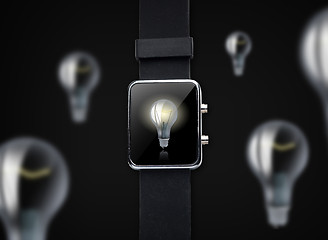 Image showing close up of smart watch with light bulb on screen