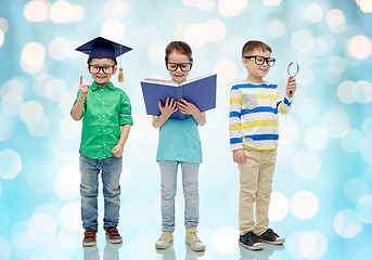 Image showing kids in glasses with book, lense and bachelor hat