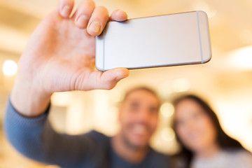 Image showing close up of couple taking smartphone selfie