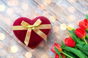 Image showing close up of red tulips and chocolate box