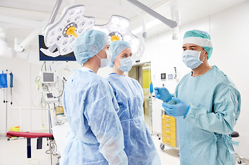 Image showing group of surgeons in operating room at hospital