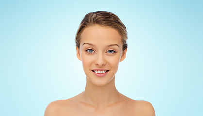 Image showing smiling young woman face and shoulders