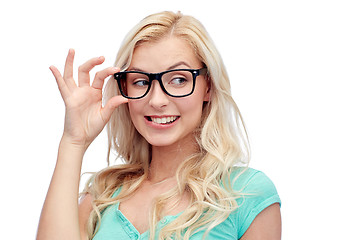 Image showing happy young woman or teenage girl in glasses