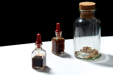 Image showing three glass bottles with herbal extracts