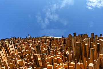 Image showing Low angle view of stacked wooden planks