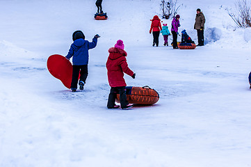 Image showing Baby winter sledding on the Ural River