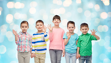 Image showing happy smiling little children holding hands