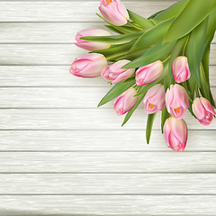 Image showing Pink tulips over white wood table. EPS 10