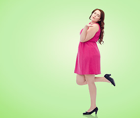 Image showing happy young plus size woman and sending blow kiss