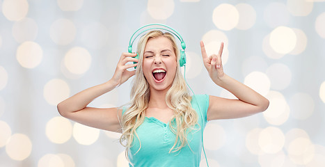 Image showing happy young woman or teenage girl with headphones